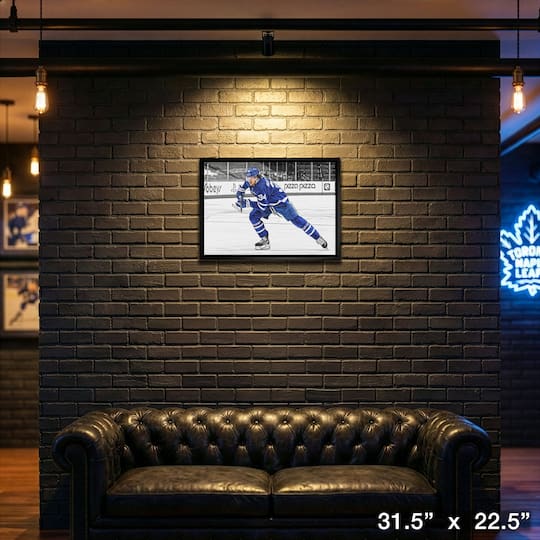 Auston Matthews Toronto Maple Leafs Framed 20" x 29" Hustling Spotlight Canvas 31.5" x 22.5"